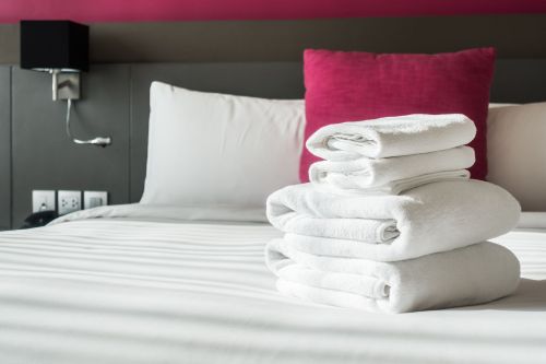 folded-towels-bed.jpg