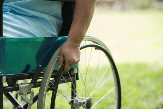 close-up-lonely-elderly-woman-sitting-wheelchair-garden-hospital.jpg